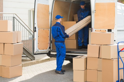 Removal company team preparing items for collection