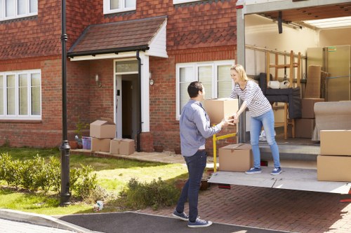 Brent removals team handling furniture during a local house move
