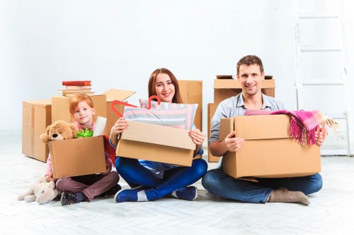 Packed boxes and furniture prepared for flat removals in Brent