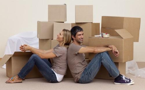 Experienced Brent house movers organising fragile items for safe transport