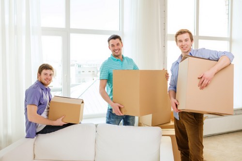 Local office relocation team handling desks and equipment in Brent