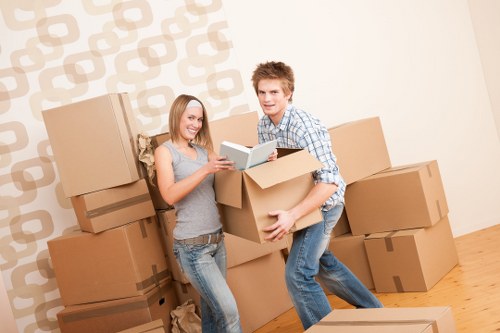 Local Brent moving team planning a house relocation on a residential street